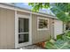 Inviting entrance featuring a screen door, window box, and lush foliage at 4021 Vana Dr, Sarasota, FL 34241