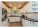Updated kitchen with white cabinets, granite countertops, and subway tile backsplash at 4021 Vana Dr, Sarasota, FL 34241