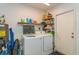 Convenient laundry room featuring modern washer and dryer, plus ample storage space at 4021 Vana Dr, Sarasota, FL 34241