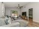 Spacious living room with a sliding glass door to patio and view into the main bedroom at 4021 Vana Dr, Sarasota, FL 34241