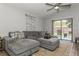 Comfortable living room with a large sectional sofa and sliding glass doors leading to the backyard at 4021 Vana Dr, Sarasota, FL 34241