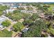 Aerial view showcases the property's location with surrounding buildings, roadways and community parks at 4412 Bray Rd, Tampa, FL 33634