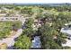 Aerial view showcases the property's location with surrounding golf courses, roadways and a glimpse of the ocean at 4412 Bray Rd, Tampa, FL 33634