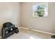 Simple bedroom featuring tile floors and a window view at 4412 Bray Rd, Tampa, FL 33634