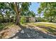 Well-maintained exterior with mature trees offering shade and curb appeal to the property at 4412 Bray Rd, Tampa, FL 33634