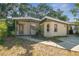 Charming one-story home with a covered porch, providing a welcoming entrance at 4412 Bray Rd, Tampa, FL 33634