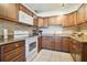 Functional kitchen featuring granite countertops, ample cabinetry, and tile backsplash at 4412 Bray Rd, Tampa, FL 33634