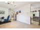 Spacious living area featuring tile floors, stainless steel refrigerator, and neutral walls at 4412 Bray Rd, Tampa, FL 33634