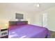 Bright bedroom features hardwood floors, a ceiling fan, and a gray window shade at 4412 Bray Rd, Tampa, FL 33634