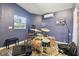 Interior of a blue music room featuring a full drum set, air conditioning, and a window at 4412 Bray Rd, Tampa, FL 33634