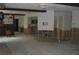 Spacious living room with wood beams, ceiling fan, and partial wall framing at 4673 Dewey Dr, New Port Richey, FL 34652