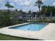 Inviting in-ground pool surrounded by a concrete patio, perfect for relaxation at 4673 Dewey Dr, New Port Richey, FL 34652