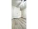 Bedroom featuring wood-look laminate flooring and neutral paint scheme at 501 E Bay Dr # 3504, Largo, FL 33770