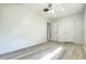 Clean bedroom featuring wood-look laminate flooring and neutral paint scheme at 501 E Bay Dr # 3504, Largo, FL 33770