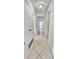 Hallway with tile floors, white doors, and neutral color palette at 501 E Bay Dr # 3504, Largo, FL 33770