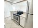 Hallway with tile floors, white doors, and neutral color palette at 501 E Bay Dr # 3504, Largo, FL 33770