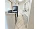 Efficient kitchen featuring white cabinets and modern appliances at 501 E Bay Dr # 3504, Largo, FL 33770