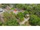 Aerial perspective of bungalow, highlighting its location amid mature trees and surrounding homes at 502 Lincoln Ave, Tarpon Springs, FL 34689