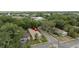 Aerial shot showcases the charming bungalow amidst lush greenery and neighborhood streets at 502 Lincoln Ave, Tarpon Springs, FL 34689