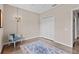 Cozy bedroom with a chandelier, closet, and polished concrete floors under a patterned area rug at 502 Lincoln Ave, Tarpon Springs, FL 34689