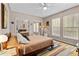 Inviting bedroom featuring a colorful rug, ample natural light, and a closet with mirrored doors at 502 Lincoln Ave, Tarpon Springs, FL 34689