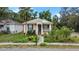Charming bungalow with manicured landscaping and inviting front porch at 502 Lincoln Ave, Tarpon Springs, FL 34689