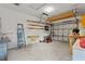 Spacious garage with ample storage solutions and a ceiling fan for added comfort at 502 Lincoln Ave, Tarpon Springs, FL 34689