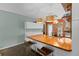 Bright kitchen featuring a wooden countertop island and contemporary lighting fixtures at 502 Lincoln Ave, Tarpon Springs, FL 34689
