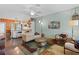 Open-concept living room connected to a kitchen with an eat-in bar at 502 Lincoln Ave, Tarpon Springs, FL 34689