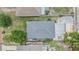 An aerial view of the property showcasing its roof, backyard with a sitting area and landscaping at 507 4Th Sw Ave, Largo, FL 33770