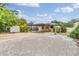 Wide view of the home's backyard and covered patio area at 507 4Th Sw Ave, Largo, FL 33770