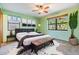 Well-lit bedroom with modern decor, large windows, and plant accents at 507 4Th Sw Ave, Largo, FL 33770