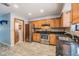 Well-equipped kitchen with stainless steel appliances, granite countertops, and wooden cabinets at 507 4Th Sw Ave, Largo, FL 33770