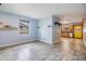 Bright living room with tile floors and light-filled interior, seamlessly connecting to kitchen space at 507 4Th Sw Ave, Largo, FL 33770