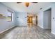 Open-concept living room with tile floors and light-filled interior, seamlessly connecting to kitchen space at 507 4Th Sw Ave, Largo, FL 33770