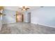Spacious living room featuring stylish gray flooring and serene blue walls, perfect for relaxation and gatherings at 507 4Th Sw Ave, Largo, FL 33770