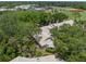 This community has lush landscaping and well-maintained roofs creating a serene and picturesque neighborhood setting at 5102 White Pine Ne Cir, St Petersburg, FL 33703