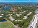 This aerial view highlights the community's proximity to lakes, the bay, and the nearby baseball field for recreational activities at 5102 White Pine Ne Cir, St Petersburg, FL 33703