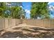 Fenced backyard with gate access, providing a secure space for outdoor enjoyment and activities at 5102 White Pine Ne Cir, St Petersburg, FL 33703