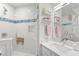 Stylish bathroom featuring a glass shower, white vanity, and modern fixtures at 5102 White Pine Ne Cir, St Petersburg, FL 33703
