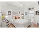 Cozy bedroom with a bed dressed in white linens and multiple windows for natural light at 5102 White Pine Ne Cir, St Petersburg, FL 33703