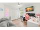Functional bedroom with a desk, large closet, and cozy beanbag chairs at 5102 White Pine Ne Cir, St Petersburg, FL 33703