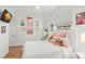 Comfortable bedroom with white walls and ceiling fan, perfect for relaxation at 5102 White Pine Ne Cir, St Petersburg, FL 33703