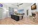 Dining area with modern decor, fireplace, and view to the landscaped backyard at 5102 White Pine Ne Cir, St Petersburg, FL 33703