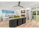 Dining room featuring a large table, modern decor, and view to the landscaped backyard at 5102 White Pine Ne Cir, St Petersburg, FL 33703
