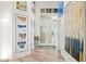 Bright foyer with hardwood floors, high ceilings, and decorative artwork at 5102 White Pine Ne Cir, St Petersburg, FL 33703