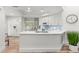 Modern kitchen with white cabinetry, a center island, and stainless steel appliances at 5102 White Pine Ne Cir, St Petersburg, FL 33703