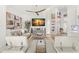 Elegant living room with stylish artwork, a large TV, and comfortable seating at 5102 White Pine Ne Cir, St Petersburg, FL 33703