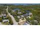 Panoramic aerial view of the property nestled in a serene waterfront community at 5270 Miller Bayou Dr, Port Richey, FL 34668