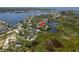 Aerial view featuring the home, nestled along the water, highlighted by a red arrow at 5270 Miller Bayou Dr, Port Richey, FL 34668
